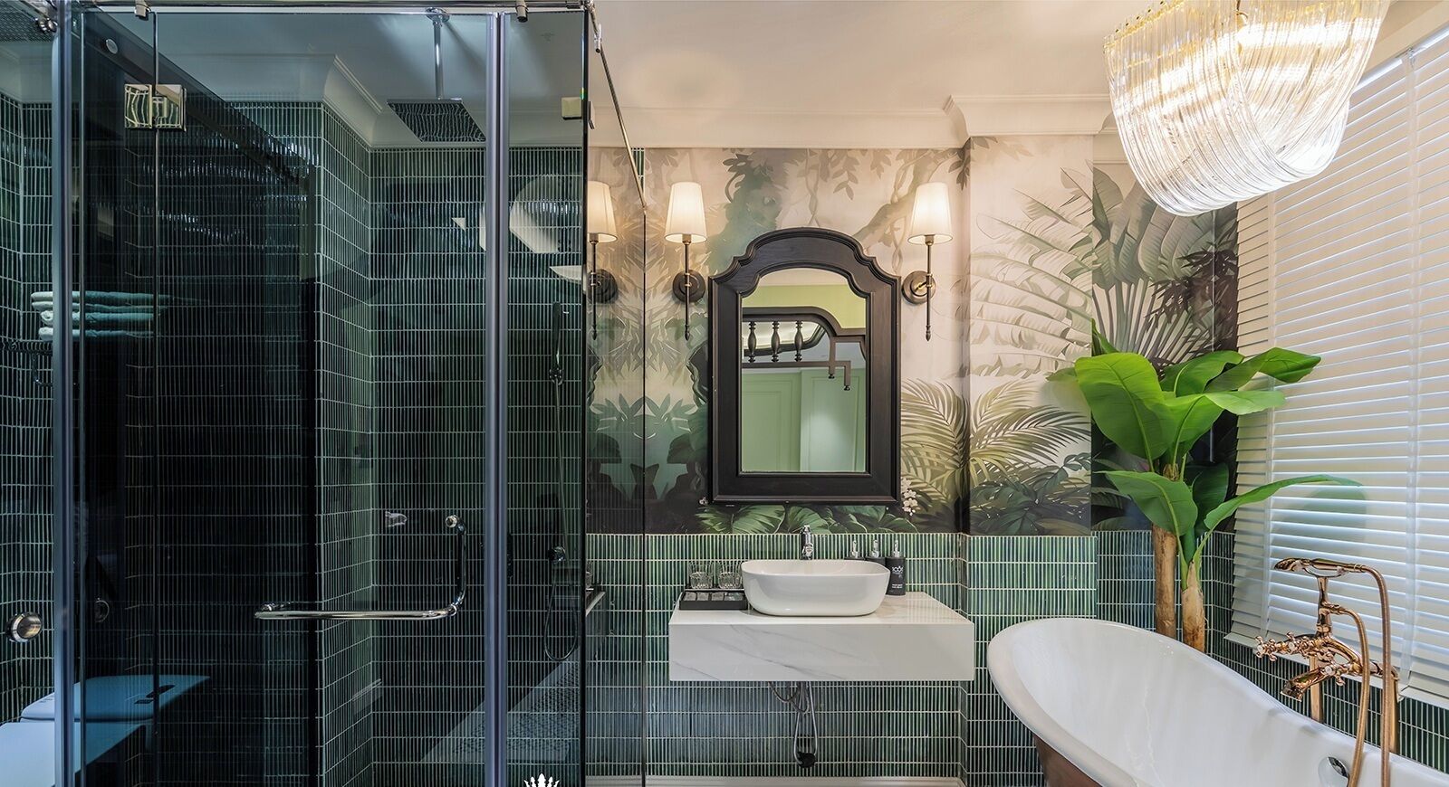 A bathroom with a glass shower enclosure, a white sink, a large mirror, and a freestanding bathtub.