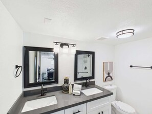 Shower, hair dryer, towels, shampoo