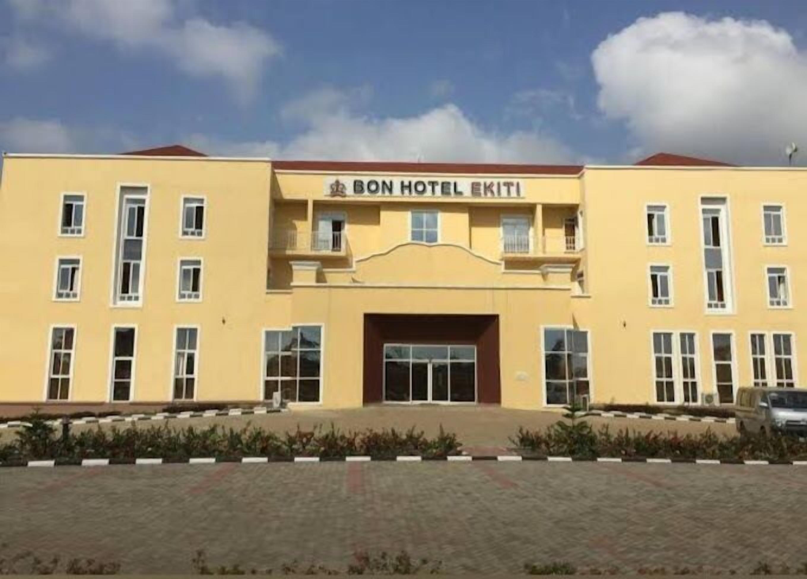 A two-story building with a sign reading "BON HOTEL EKITI" at the entrance.