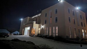 A multi-story hotel building with illuminated signage and windows. - BON Hotel  (Ado Ekiti)