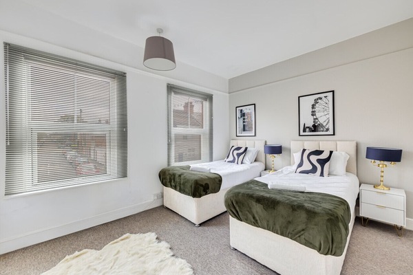 Bedroom 1 with comfortable zip and link beds which is configured as two single beds by default or can be zipped together to form a king size bed upon request.