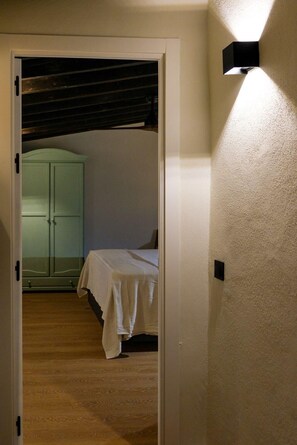 1 bedroom, desk, iron/ironing board, travel crib