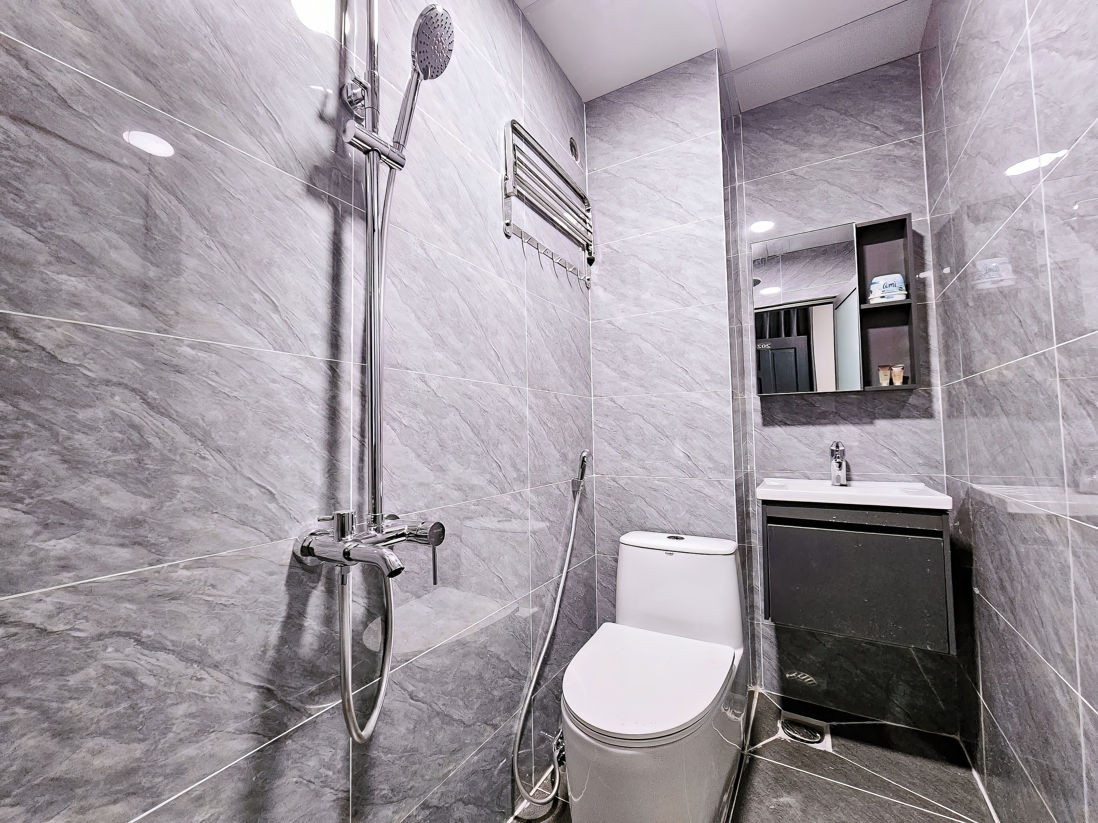 Triple Room, City View | Bathroom | Shower, free toiletries, hair dryer, slippers