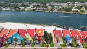 A coastal residential area with colorful houses, a marina, and a beach. - 🏖️🏝️Waterfront-Inlet Beach-Pool & Hot Tub-Red Retreat (Pensacola)