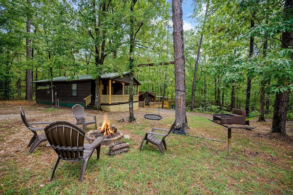 Nestled in the heart of the forest, this cozy cabin offers the perfect escape into nature and tranquility with the surrounding trees.