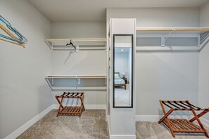 A room with a built-in closet, two wooden drying racks, and a mirror. - Mountain Haven Retreat w/Hot Tub & Sauna STR-283 (Buena Vista)