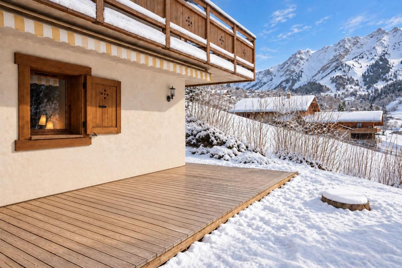 A wooden deck leading to a building with a window and a balcony.