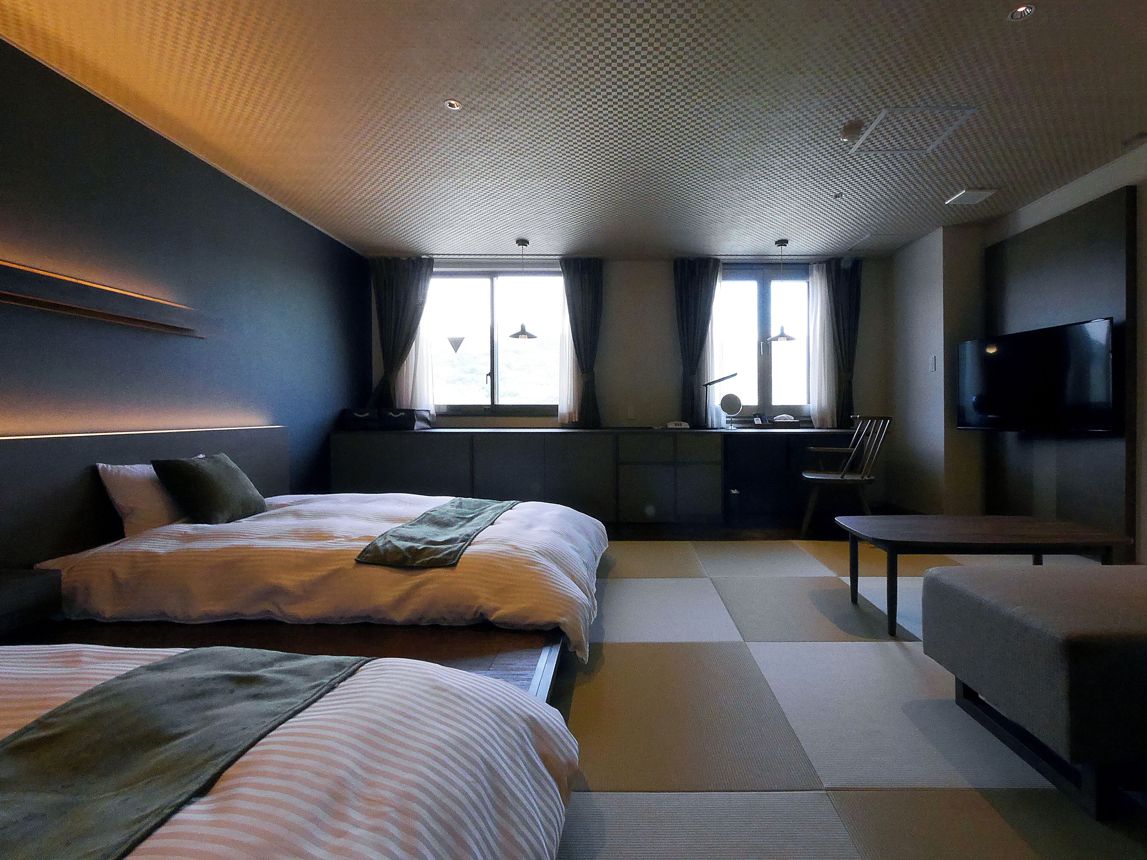 Deluxe fyrbäddsrum | Memory foam-madrasser, skrivbord och mörkläggningsgardiner
