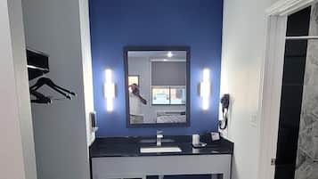 Bathtub, hair dryer, towels, soap