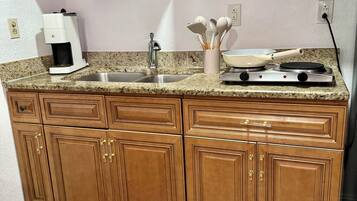 Fridge, microwave, stovetop, coffee/tea maker