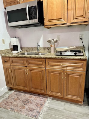 Fridge, microwave, stovetop, coffee/tea maker