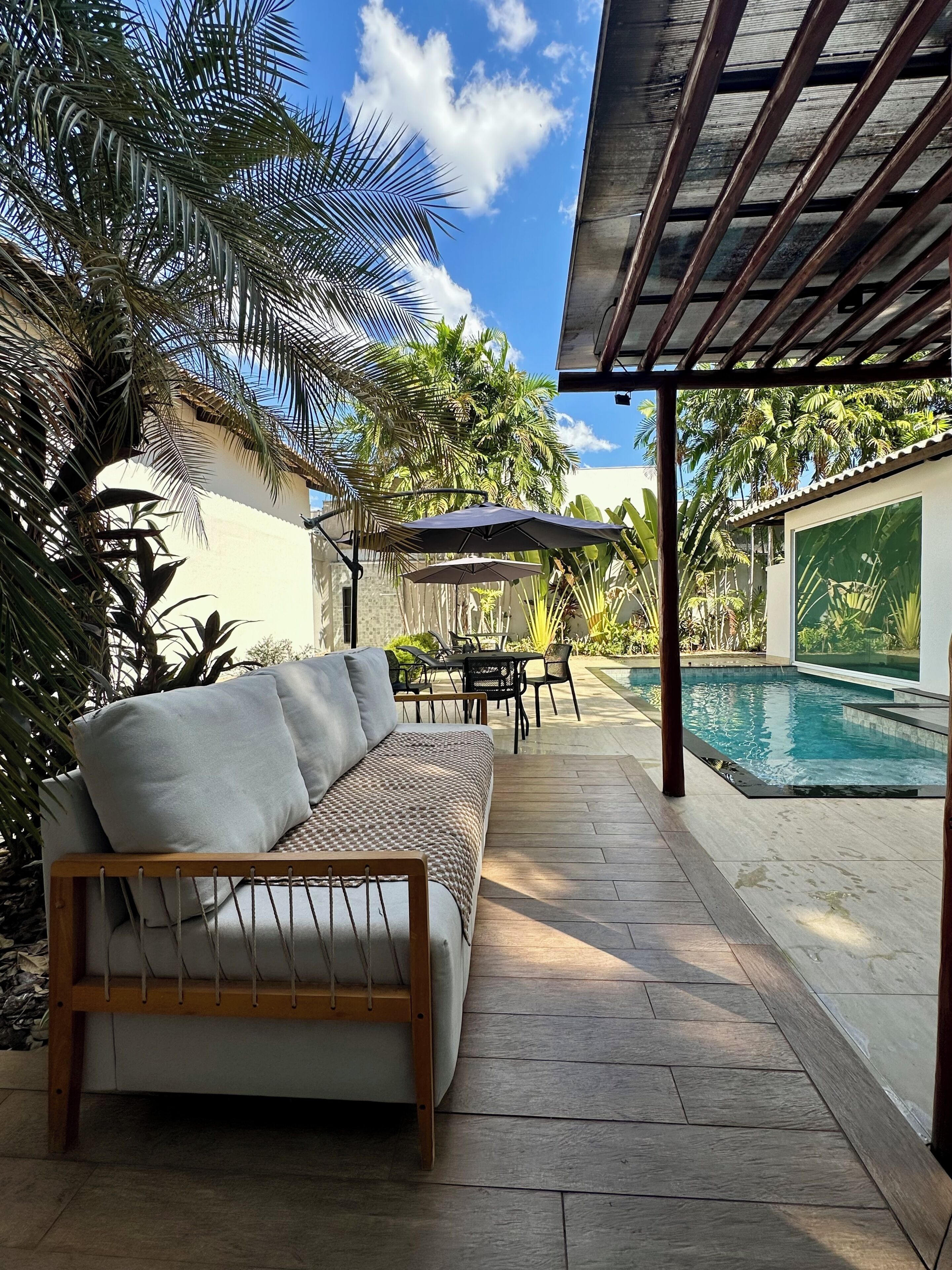 Outdoor pool, open 9:00 AM to 9:00 PM, pool umbrellas, pool loungers