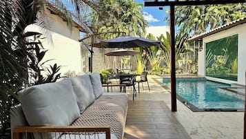 Outdoor pool, open 9:00 AM to 9:00 PM, pool umbrellas, pool loungers