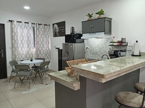 Fridge, microwave, stovetop, coffee/tea maker