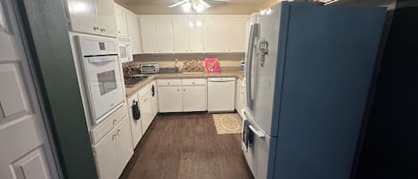 Fridge, microwave, stovetop, cookware/dishes/utensils