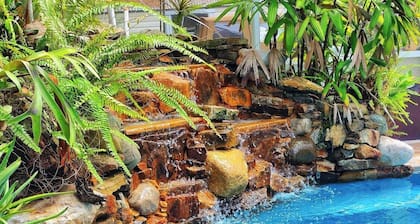 Spacious 5-bedroom Estate Home with a country club back porch pool & waterfall