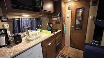 Fridge, microwave, stovetop, coffee/tea maker