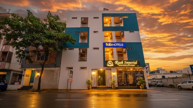A multi-story hotel with a modern facade, featuring a prominent Rush Imperial sign. - Fabhotel Rush Imperial (Indore)