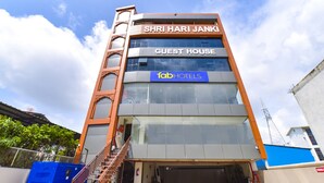 A multi-story building with a sign reading "SHRI HARI JANK GUEST HOUSE" and "fabHOTELS" on the facade. - Fabhotel Elite (Dehradun)
