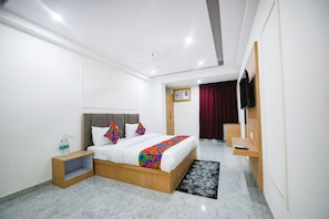 ห้องดีลักซ์ | ผ้าปูที่นอนฝ้ายอียิปต์, เครื่องนอนระดับพรีเมียม, ตู้นิรภัยในห้องพัก