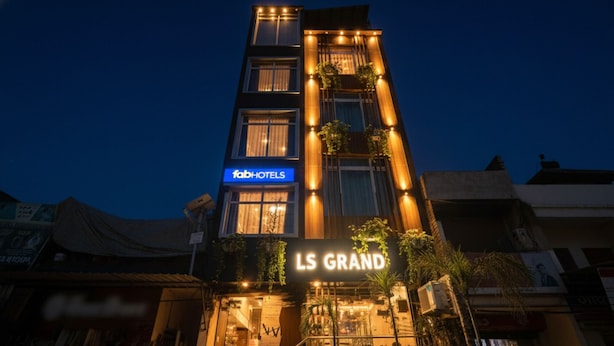 A building with a sign for 'fabHOTELS' and 'LS GRAND'. - Fabhotel Ls Grand (Varanasi)