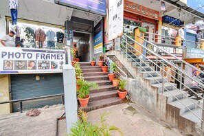 Stairs lead to various shops and services in this bustling commercial building.
