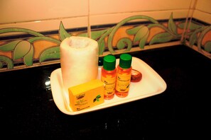 A soothing ambiance is set with a candle and Nature's Milk products on a stylish countertop.