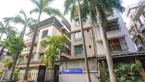 A multi-story building with a sign for 'Fab Hotels'. - Fabhotel Abhisiddhi Residency (Navi Mumbai)