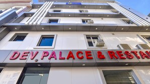 A building with a sign reading "DEV PALACE & RESTAURANT". - Fabhotel Dev Palace (Haridwar)