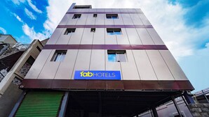 A modern building with a sign for 'fabHOTELS' on the facade. - Fabhotel Chakra (Coimbatore)