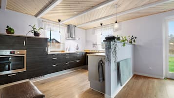 Fridge, stovetop, dishwasher, coffee/tea maker