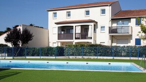 A two-story building with a swimming pool in front. - Port Saint-Jacques by Interhome (La Bernerie-en Retz)