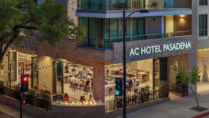The exterior of AC Hotel Pasadena with a visible restaurant and outdoor seating area. - AC Hotel Pasadena (Pasadena)