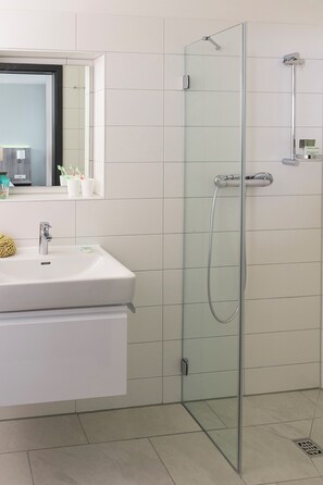 Shower, hair dryer, towels, soap