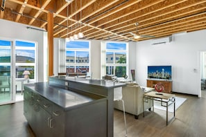 Enjoy cooking in this well-equipped kitchen with a large island, oven, and ample storage.