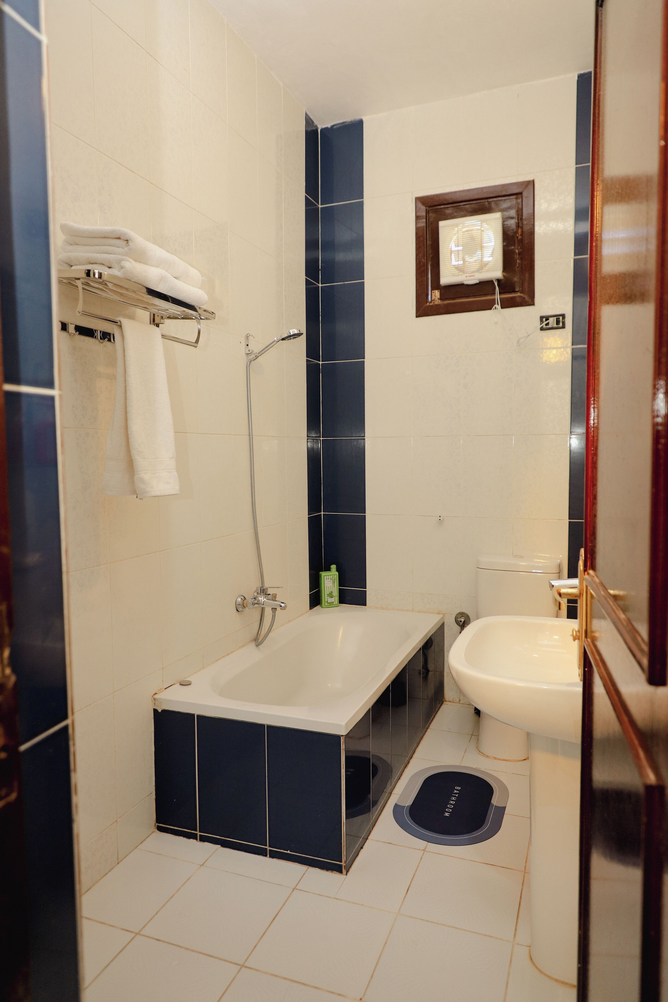 A bathroom with a bathtub, a sink, and a toilet.