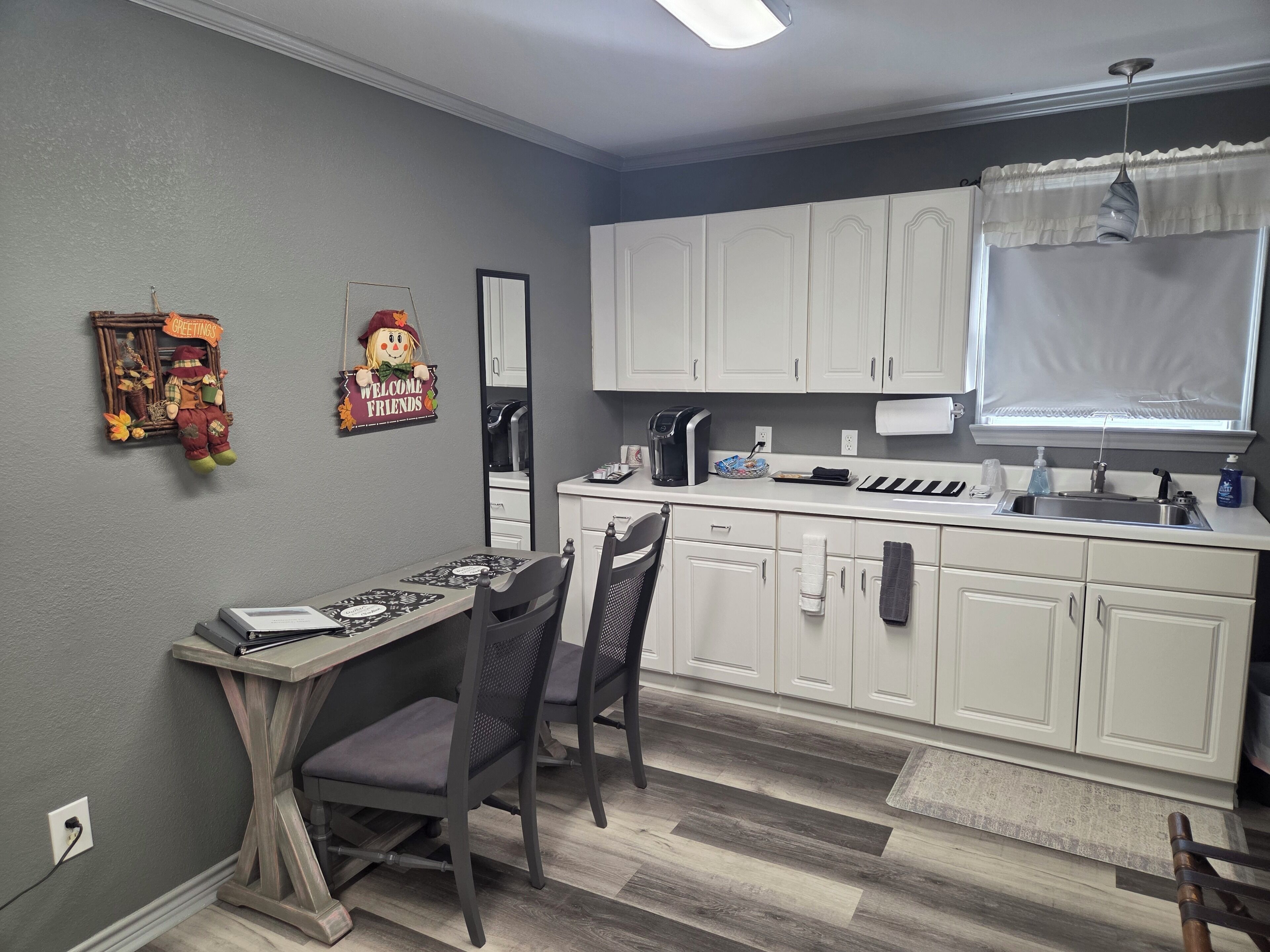 Fridge, microwave, coffee/tea maker, cookware/dishes/utensils