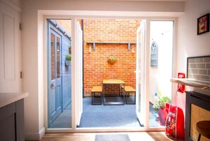 Relax in a contemporary living space with a bench and outdoor seating area.