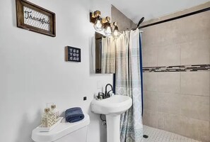 Shower, hair dryer, towels