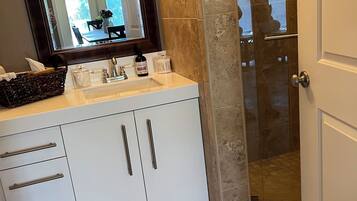 Shower, hair dryer, towels, soap