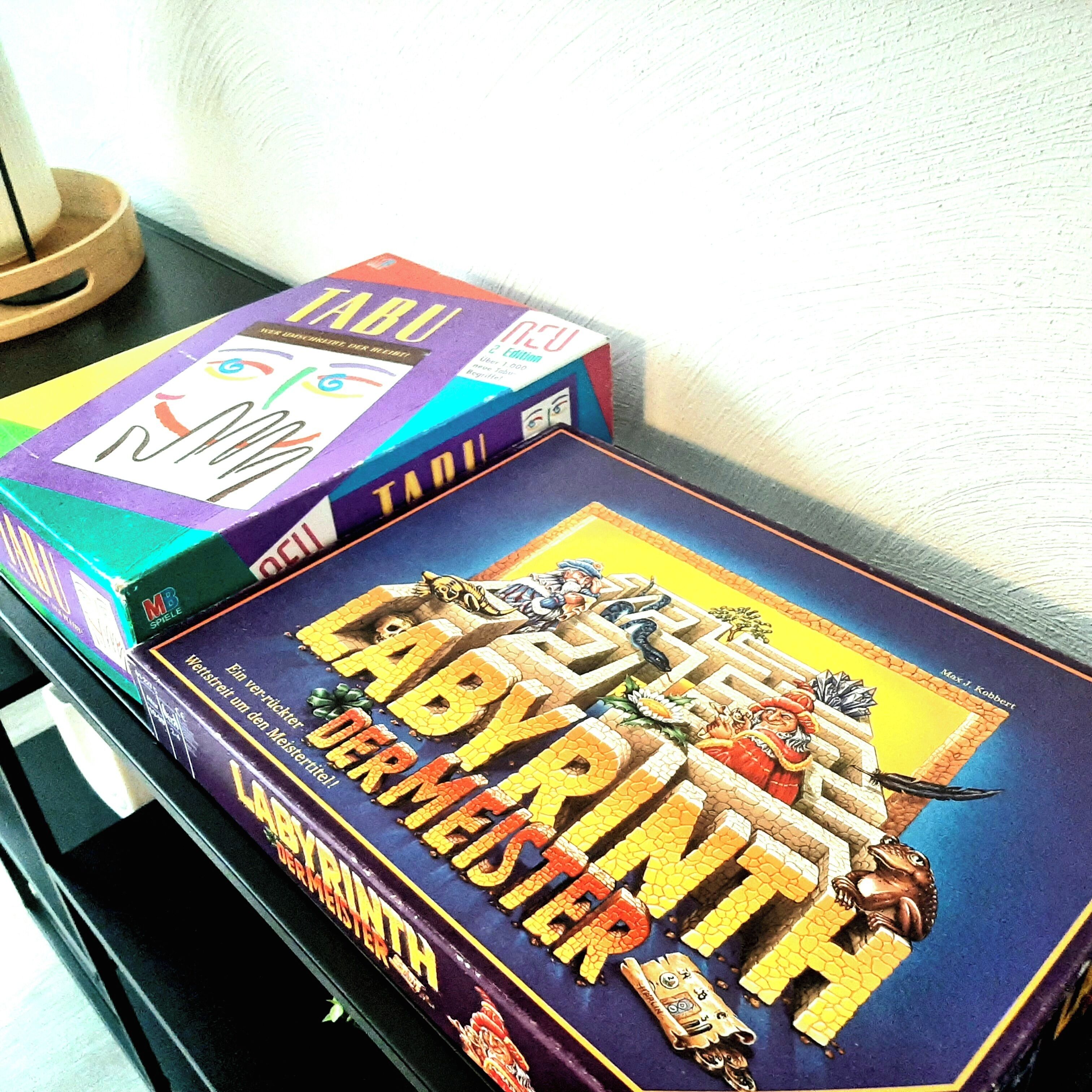 A game box titled "Labyrinth" with a maze illustration and characters on the cover.