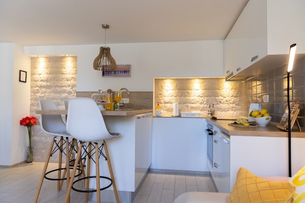 Apartment, Courtyard View | Living area | 60-cm flat-screen TV with cable channels, TV