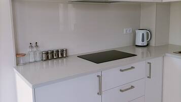Fridge, microwave, stovetop, coffee/tea maker