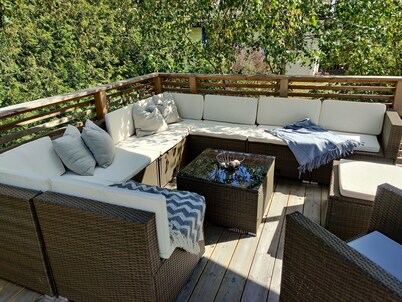 Cozy house with large wooden deck near the sea and the beach