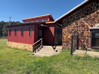 Cozy vineyard studio with peaceful pond views.