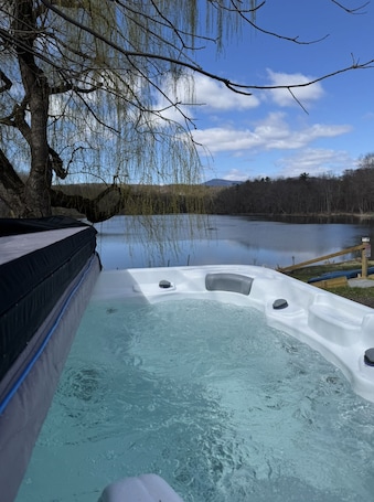 Outdoor spa tub. Cozy Waterfront Oasis – Hot Tub, Sauna, Firepit, Creek Views, Pet Friendly
