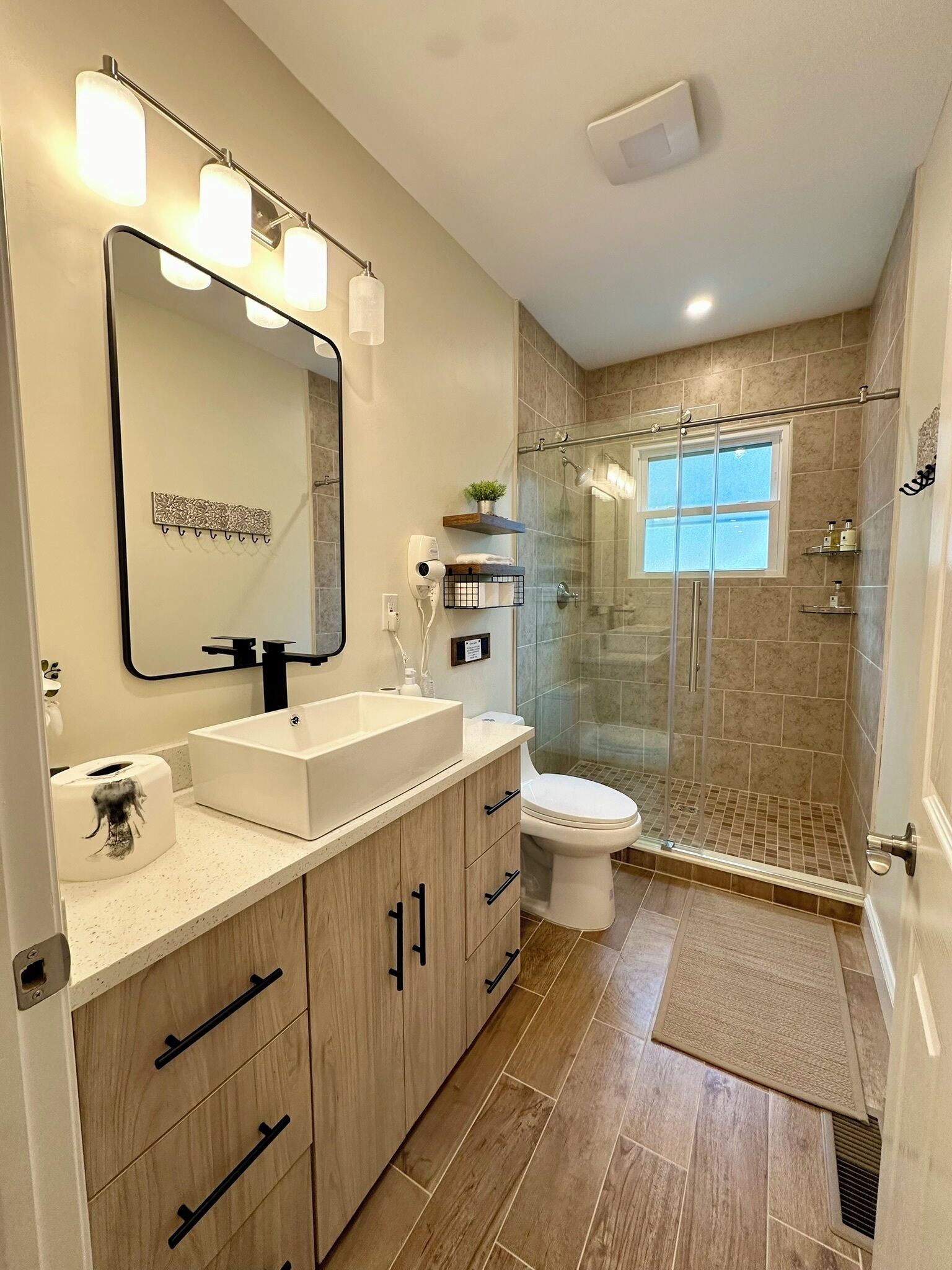 Shower, hair dryer, towels, soap