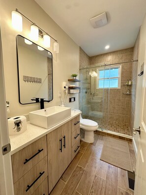 Shower, hair dryer, towels, soap