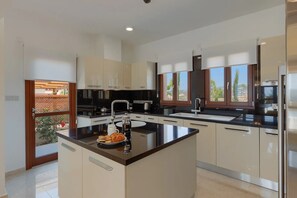 Fridge, microwave, oven, stovetop - Unmatched Luxury: Stunning Views & Elegance at Paphos Villa 1470. (Paphos)