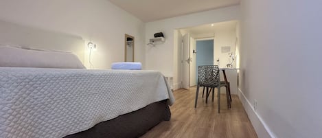 Deluxe Room, Bay View | Desk, laptop workspace, blackout drapes, iron/ironing board